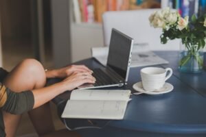 Landlord managing tenants on their laptop